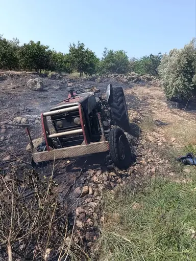 Erzin’de otluk alanda çıkan yangında alevler traktöre sıçradı

