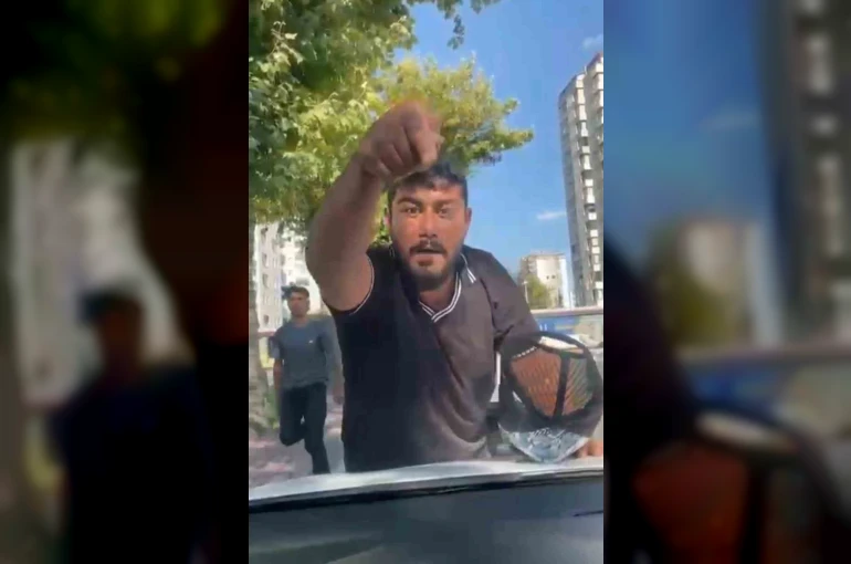 Cam silme bahanesiyle aracın kaputuna yatıp zorla para istemişti, tutuklandı